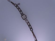 LADY'S SILVER ENCASED COCKTAIL WATCH, London 1958, square dial Titus seventeen jewel with decorative