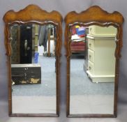 ANTIQUE STYLE REPRODUCTION WALNUT WALL MIRRORS, a pair, with shaped top detail, 93cms H, 47cms max