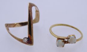 TWO 9CT GOLD DRESS RINGS to include a single diamond set wishbone, size P, the other semi-