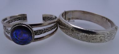 TWO BANGLES, one a 925 silver triple split bangle with large centre abalone, 31.5grms and a hollow