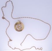 A 9CT GOLD CIRCULAR SCORPIO PENDANT, 2.9grms and a nine carat gold link chain, 3.9grms