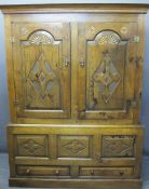 CIRCA 1800 CARVED OAK PRESS CUPBOARD with fan detail and Gothic type crosses on shaped and chamfered