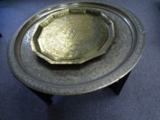 FOLDING BRASS TOP TABLE and a Persian style brass wall plaque
