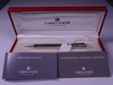 CARAN D'ACHE ECRIDOR BALLPOINT PEN - Rhodium plated with 'Retro' engraved barrel. Push button