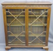 MAHOGANY TWO DOOR BOOKCASE with thirteen pane astragal glazed doors and interior adjustable shelves,