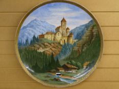 LARGE AUSTRIAN ? POTTERY WALL CHARGER depicting an alpine scene, marked 'Burg Taufers in Tirol,