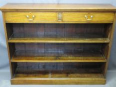 MAHOGANY STANDING BOOKCASE with two upper drawers and carved front detail on a plinth base, 105.5cms