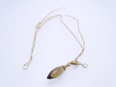 A 9CT GOLD BOX LINK NECK CHAIN with dark pear shaped peridot pendant, 3.9grms and in original