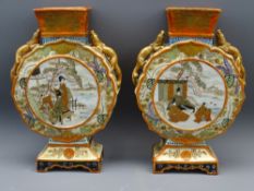 JAPANESE KUTANI MOON/PILGRIM FLASK VASES, a pair, circa 1920 with Chliong dragons to the