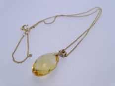 A 9CT GOLD FINE LINK CHAIN with square tiny cz mounted oval citrine pendant, 4.1grms in original