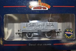 Thirteen Bachmann 00 gauge items of Rolling Stock including Vans and Wagons, all in original blue