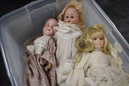 An early 20th century Armand Marseille bisque headed doll having sleep eyes, open mouth with four