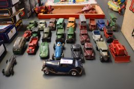 Twenty six pre and post war playworn Dinky diecast vehicles including Studebaker, Lincoln Zephyr,