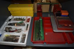 A vast collection of mixed vintage Meccano including Motors, Brass Cogs, many parts, Wheels,