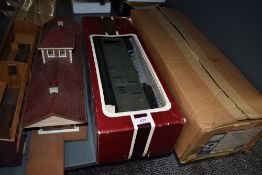 A shelf of G scale and similar accessories including Delton Lines C & S Postal Baggage Van, Station,