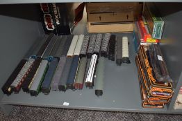 A Shelf of 30 Hornby, Bachmann, Mainline and similar 00 gauge carriages, some with boxes