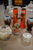 A small lot of ceramics including a pair of orange vases having bird design and hallmarked cuffs