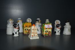 A selection of character styled salt, pepper and cruet sets including hand decorated and slipcast