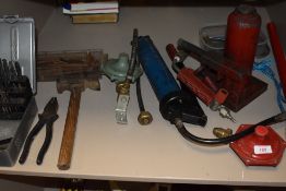 A selection of DIY and building tools including gas torches