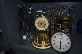A selection of table wares including Nachtmann candle sticks and brass rocking chair
