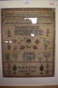 An intricate needle work sampler dated 1835 depicting alphabet with animal, plant characters and