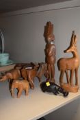 A collection of wooden animals and a brass inlaid trinket box.