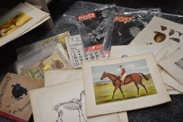A collection of ephemera including animal prints, original artwork, and picture post magazines
