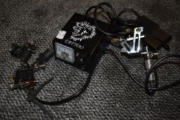 A tattoo gun and accessories