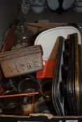 A box full of kitchenalia, including baking trays and loaf tins, also Royal Doulton mugs.