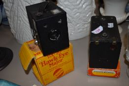 Two box cameras. A Hawkeye six-20 Major on original box and Brownie No2