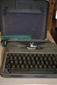 A portable typewriter by Empire The Aristocrat