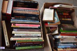 A variety of books, including photography and religious interest.