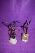 Two art deco styled figures, cast and set on agate base in a Franz Iffland design