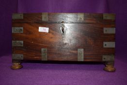 A lockable strong box having brass banding and fitments with later internals