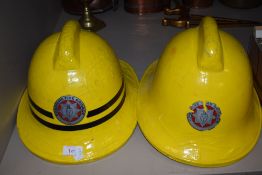 Two fire brigade helmets for the Cheshire area.