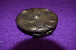 A early brass cast trivet or vase stand