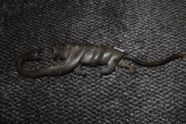 An ornamental horn or similar Tiger having an altercation with a Boa constrictor, fine details