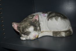 A ceramic figure of a tabby cat possibly by Cappo De Monte signed Italy to base (chips to ears)