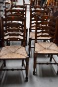 A set of eight good quality reproduction or well restored oak ladder back chairs