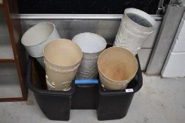 A selection of vintage plastic umbrella stand style planters