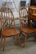 A pair of vintage Ercol hoop and stick high back kitchen dining chairs, height of back approx. 95cm