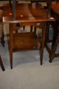 An early 20th Century late Arts and Crafts style oak occasional table, on square tapered legs,