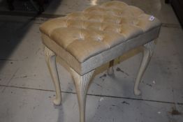 A vintage dressing table stool having dralon upholstery