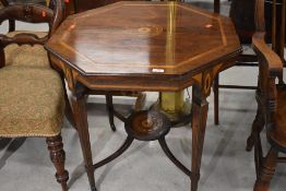 An Edwardian rosewood octagonal occasional table having typical inlay decoration, on square