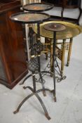 A set of three wrought iron plant stands