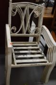 A set of four painted metal garden chairs
