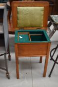 A vintage golden oak sewing table , having felt lined and part fitted interior, approx. width 47cm