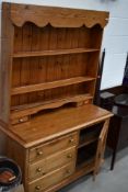 A traditional pine dresser, approx. width 120cm height 190cm