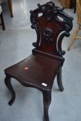 A 19th Century mahogany hall chair having shield back