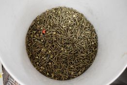A bucket of brass nails